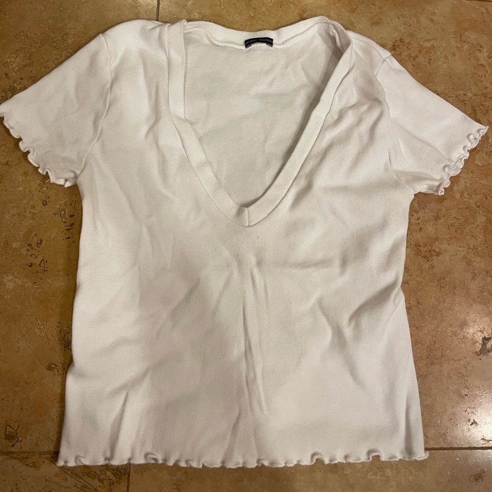 Brandy Melville. White with small ruffles. One Size
